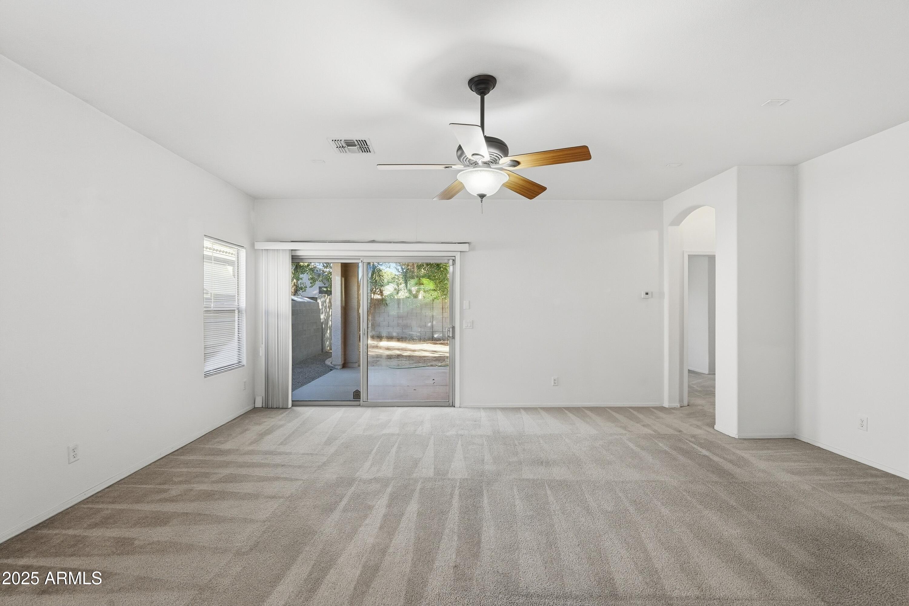 14568 West Crocus Drive Surprise, AZ 85379 - Photo 3 of 36 a view of an empty room with a window