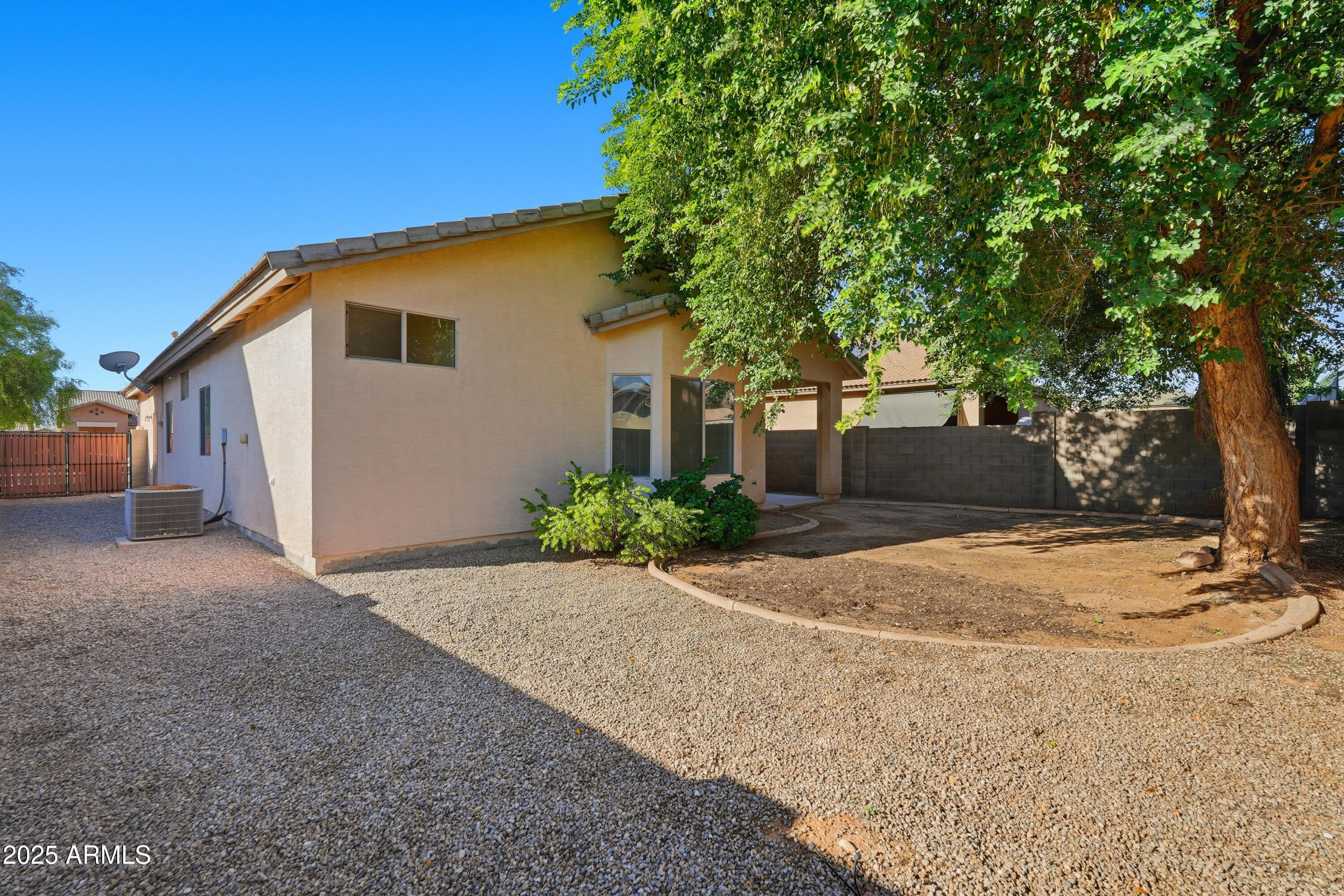 14568 West Crocus Drive Surprise, AZ 85379 - Photo 35 of 36 a view of a house with a yard and garage