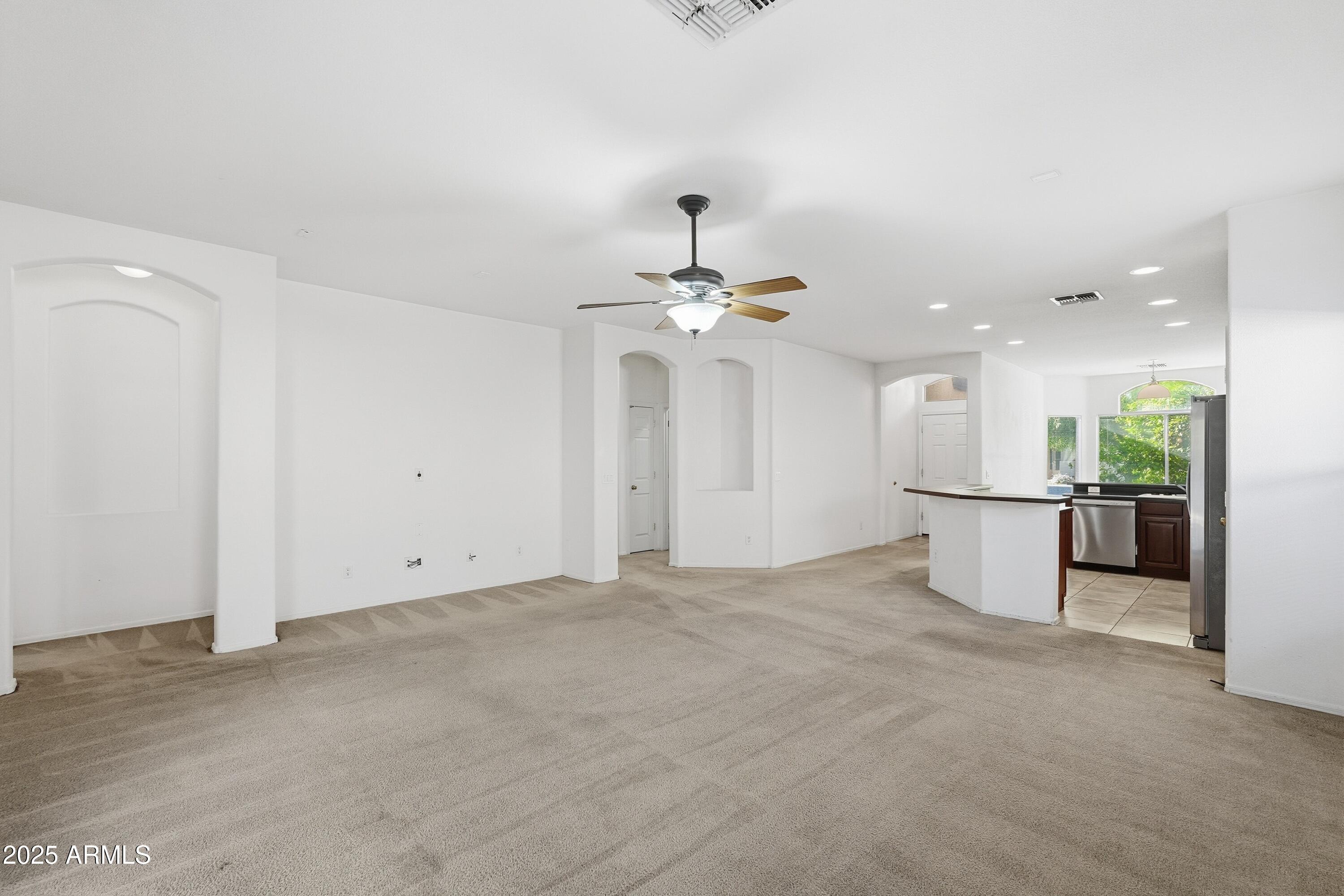 14568 West Crocus Drive Surprise, AZ 85379 - Photo 5 of 36 a view of an empty room and kitchen view
