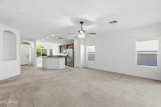 a view of a kitchen with a sink and a window