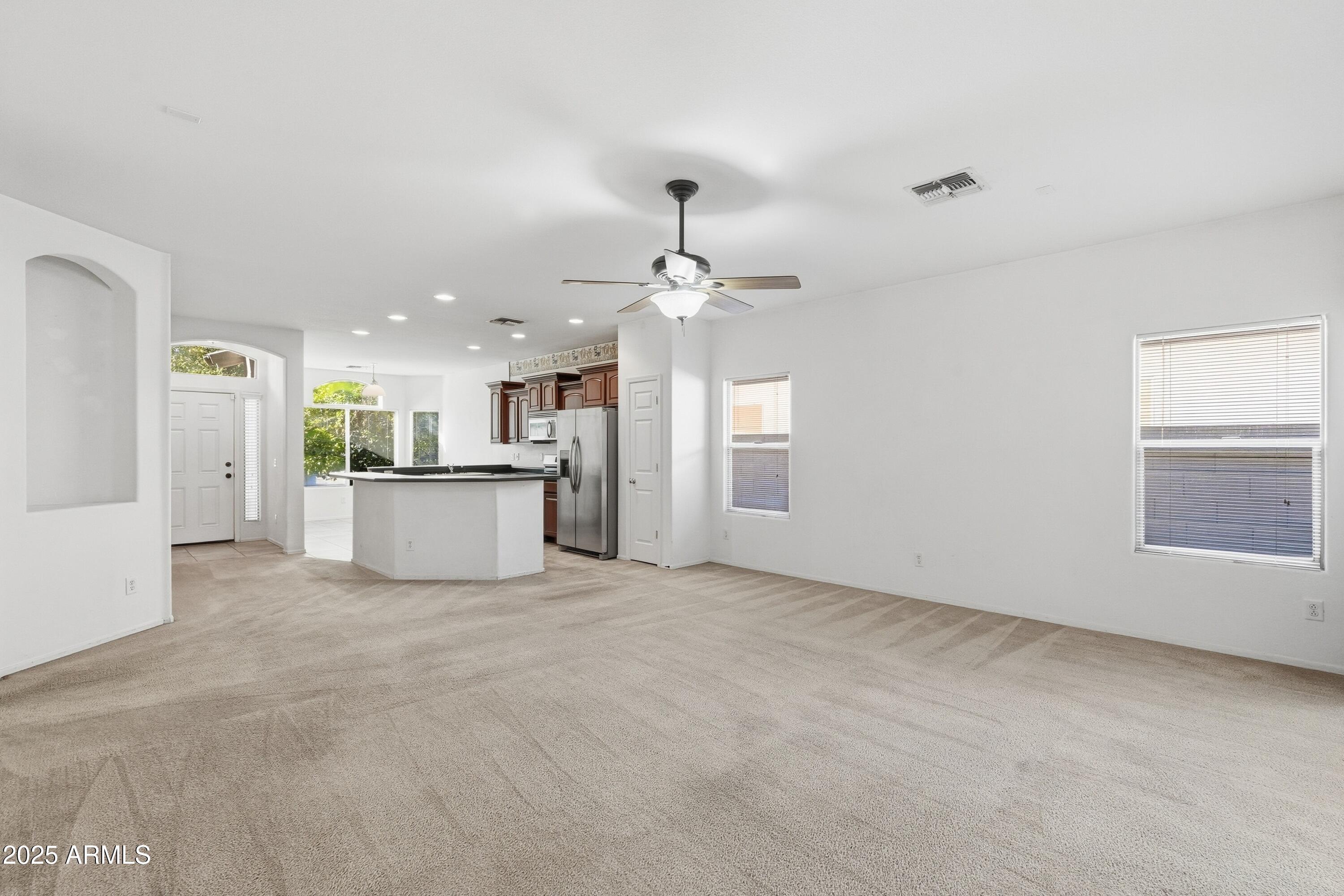 14568 West Crocus Drive Surprise, AZ 85379 - Photo 6 of 36 a view of a kitchen with a sink and a window