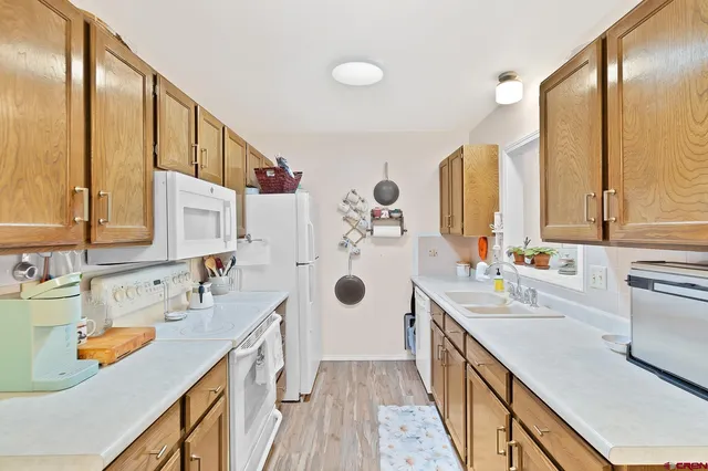 a bathroom with a double vanity sink a mirror and bathtub
