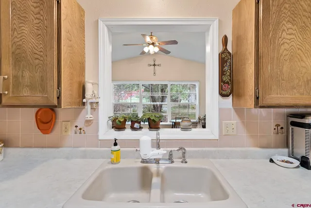 a bathroom with a sink and a window