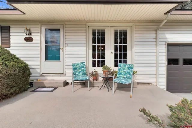 a view of a house with sitting area and furniture