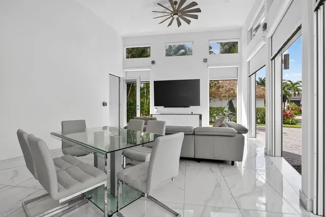 a view of a livingroom with furniture and a flat screen tv