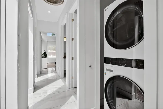 a view of a hallway with washer and dryer