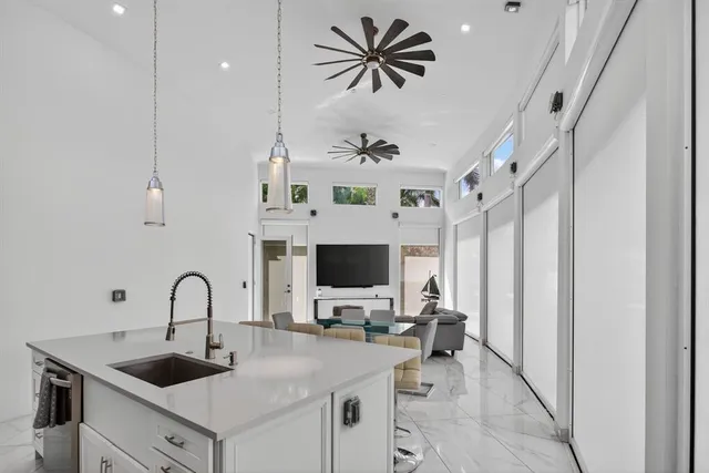 a view of a kitchen with a sink and microwave