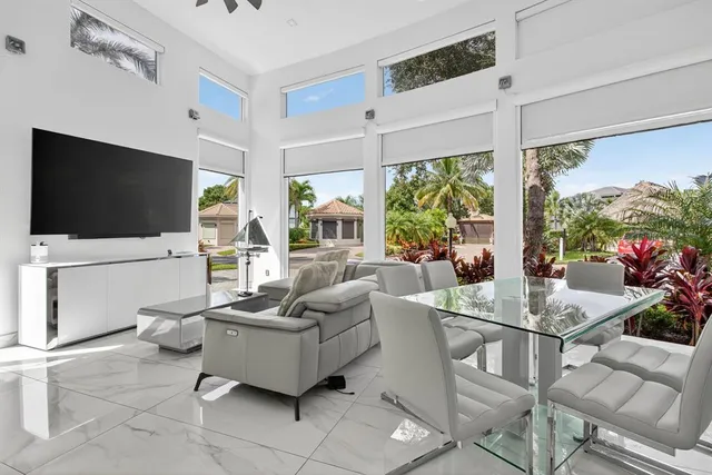 a living room with fireplace furniture and a flat screen tv