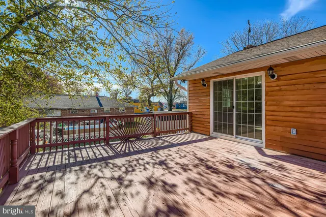 a view of balcony with wooden floor and fence