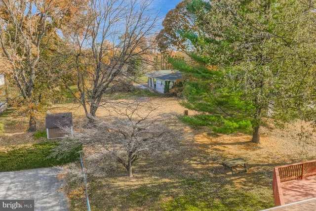 a view of a kitchen with a sink and cabinets