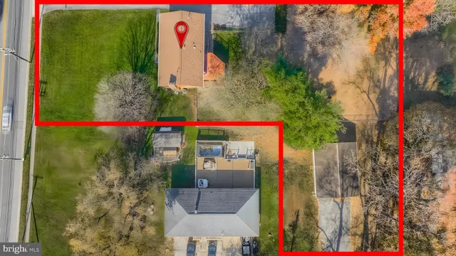 a front view of a house with a yard and fountain