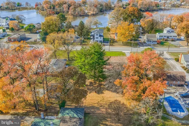 an aerial view of a house with a swimming pool