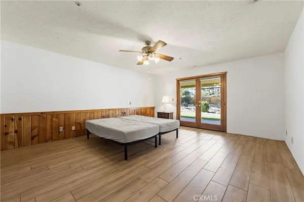a room with pool table and window