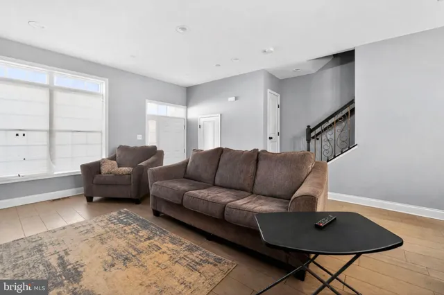 a living room with furniture and a rug