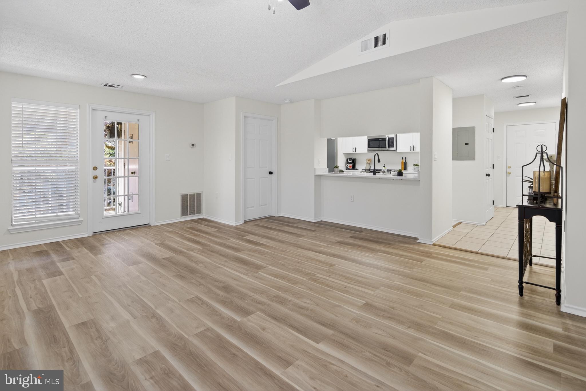21009 Timber Ridge Terrace, Unit 203 Ashburn, VA 20147 - Photo 20 of 38 Spacious, light-filled living area.
