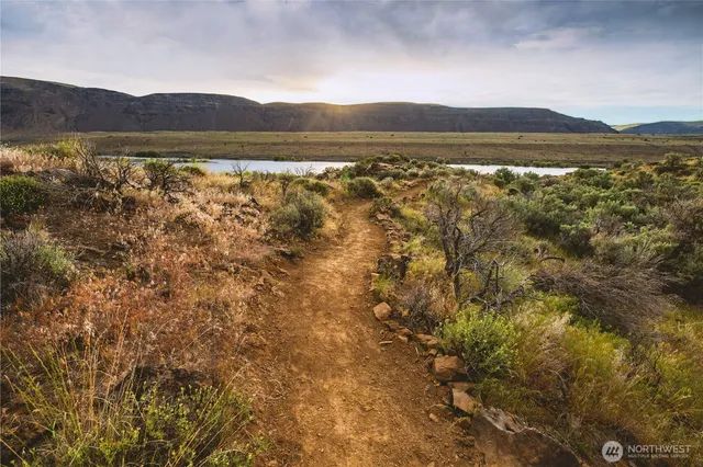 a view of lake with mountain in the background