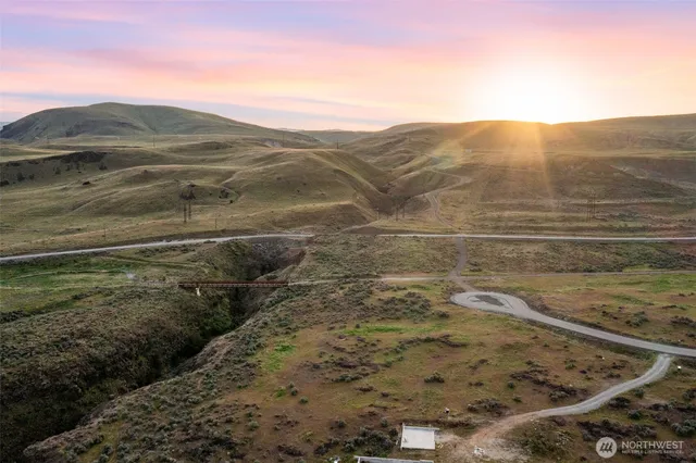 a view of mountain with an ocean