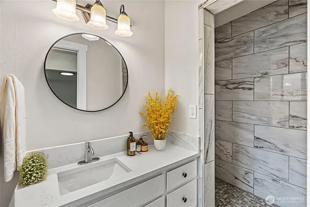 a bathroom with a sink and a mirror