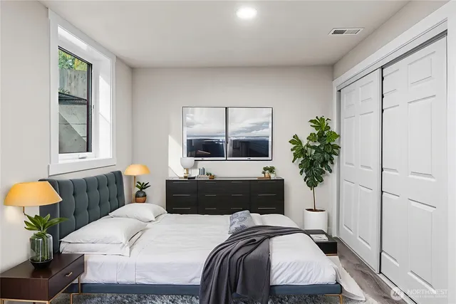 a bedroom with a bed and window