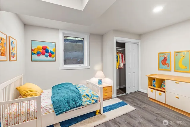 a bedroom with furniture and painting on the wall