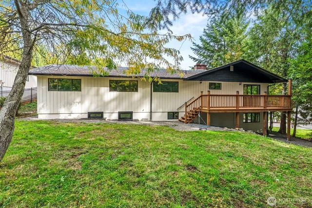 a view of backyard with a garden and entertaining space