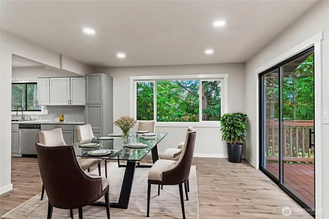 a view of a dining room with furniture window and outside view