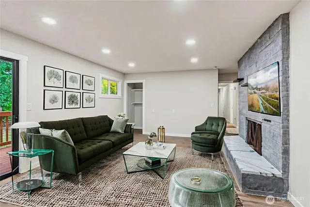 a living room with furniture and a flat screen tv