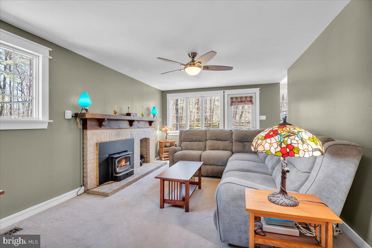 6 Vale Drive Tabernacle, NJ 08088 - Photo 16 of 45 a living room with furniture and a fireplace