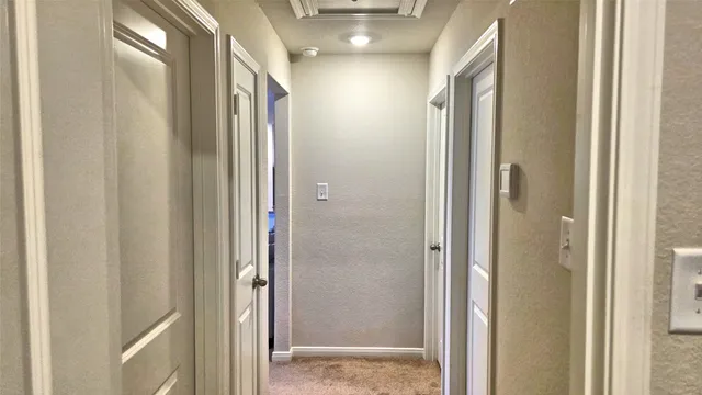 a bathroom with a glass shower door and a glass door