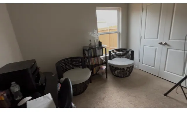 a balcony with furniture and a window