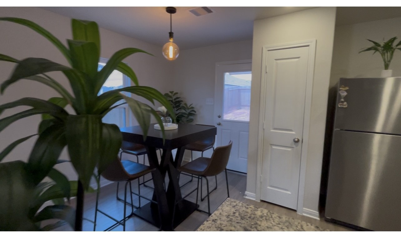 16351 Sweet Grv Drive Conroe, TX 77303 - Photo 6 of 19 a dining room with furniture and a potted plant