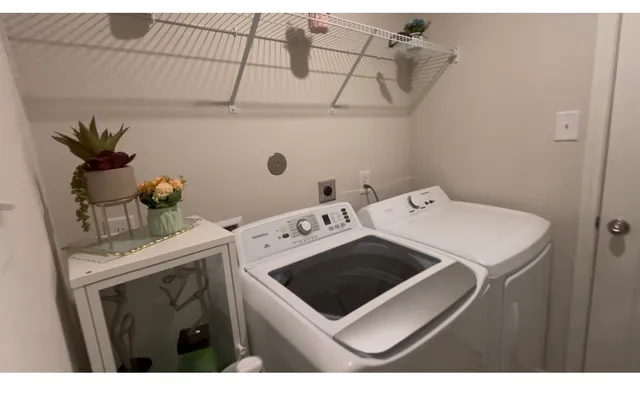 a utility room with dryer and washer