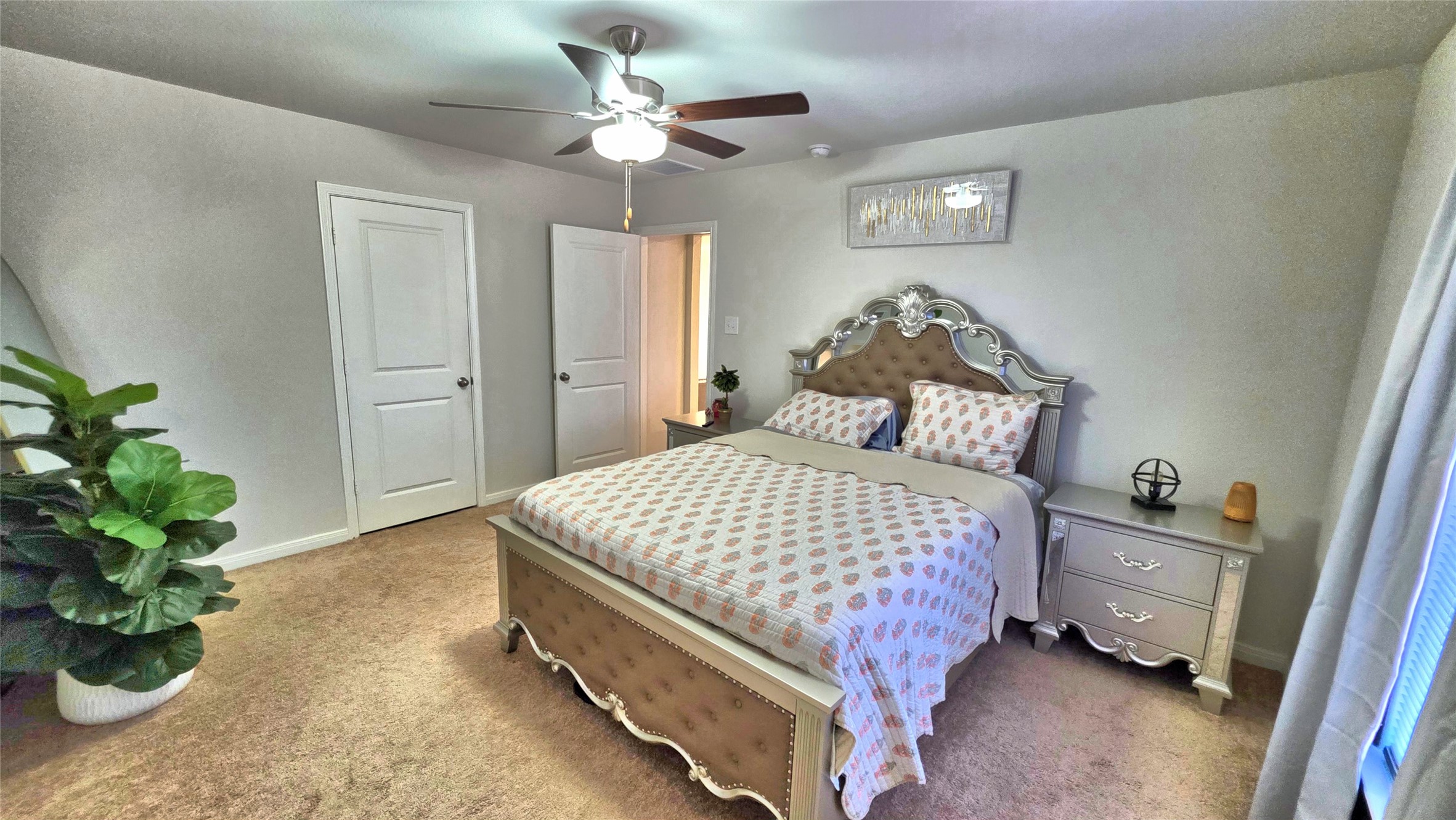 16351 Sweet Grv Drive Conroe, TX 77303 - Photo 10 of 19 a bedroom with a bed and a chandelier