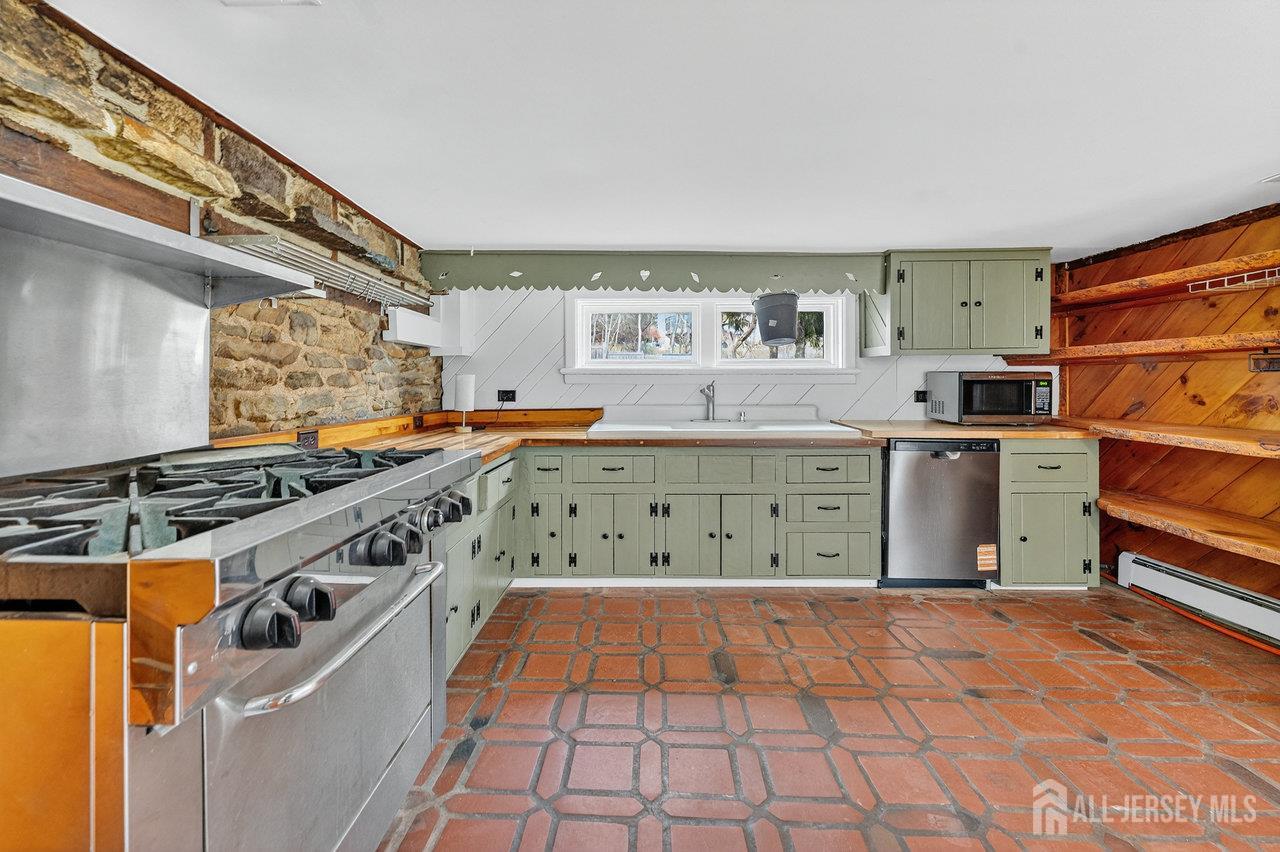 28 Old Clinton Road Flemington, NJ 08822 - Photo 13 of 39 a kitchen with stainless steel appliances granite countertop a stove and a sink