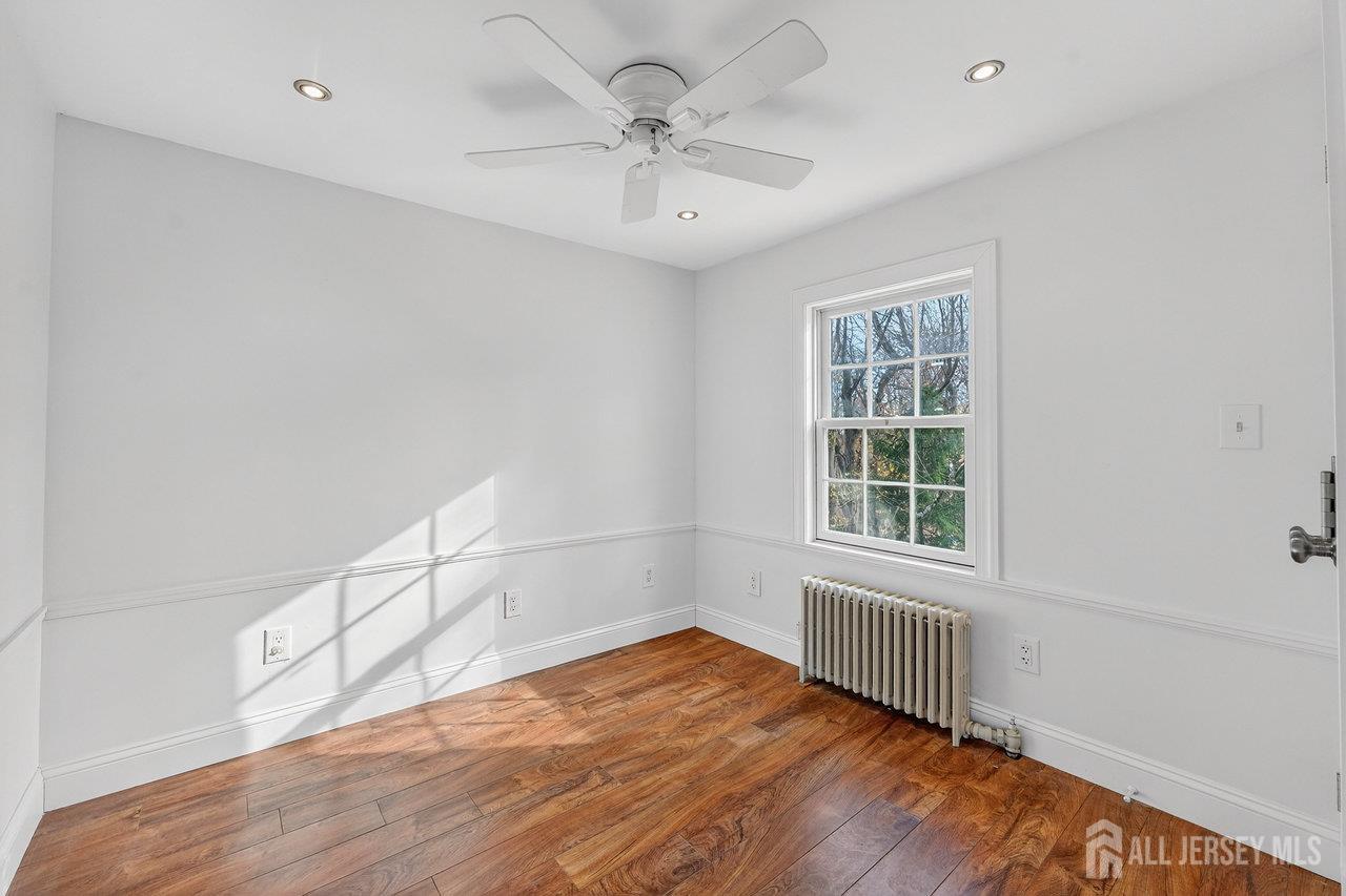 28 Old Clinton Road Flemington, NJ 08822 - Photo 18 of 39 wooden floor in an empty room with a window