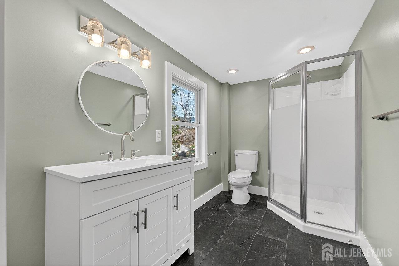 28 Old Clinton Road Flemington, NJ 08822 - Photo 19 of 39 a bathroom with a toilet sink and mirror