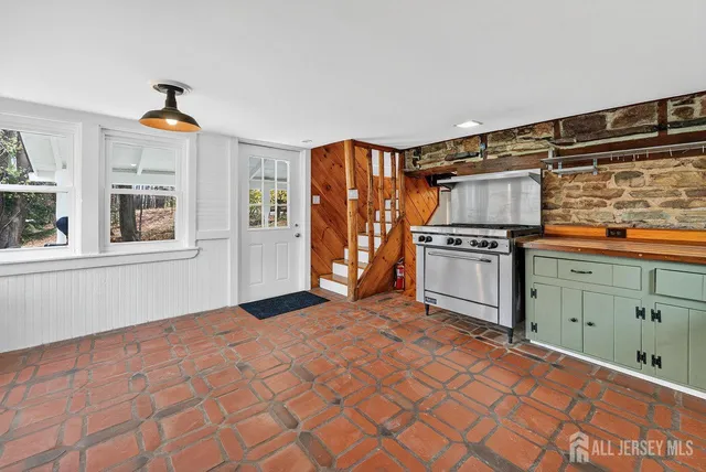 a kitchen with stainless steel appliances a stove and a refrigerator