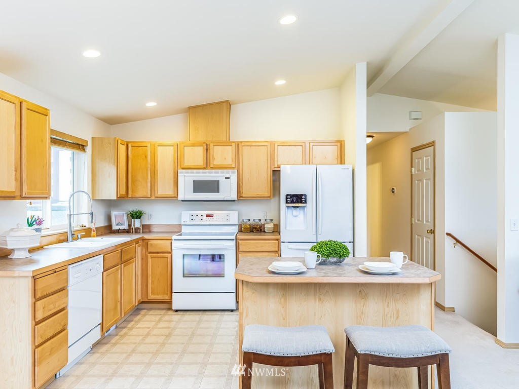 17022 105th Avenue Southeast Renton, WA 98055 - Photo 2 of 20 a kitchen with a table and chairs in it