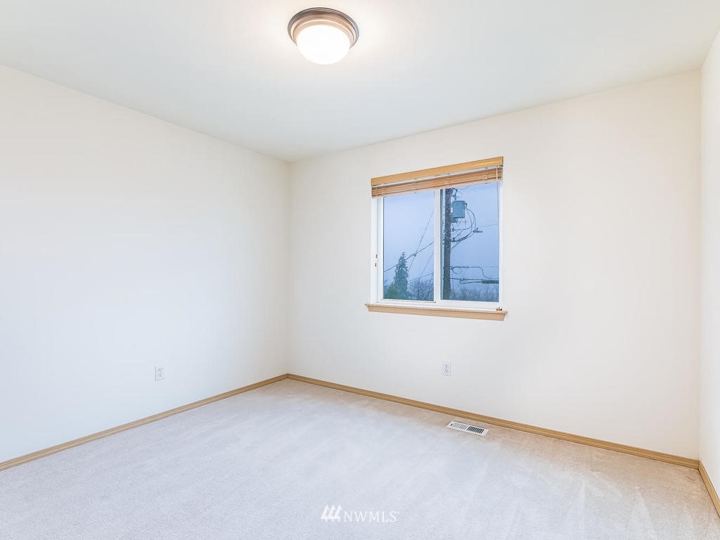 17022 105th Avenue Southeast Renton, WA 98055 - Photo 11 of 20 an empty room with a window