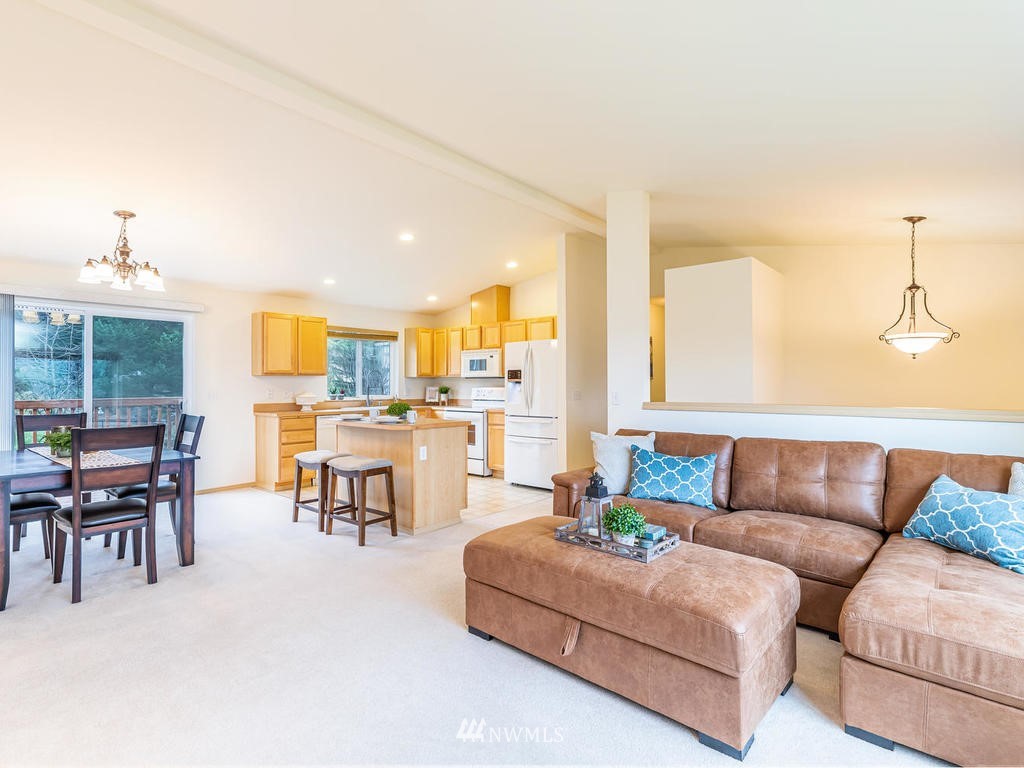 17022 105th Avenue Southeast Renton, WA 98055 - Photo 6 of 20 a living room with furniture kitchen view and a large window