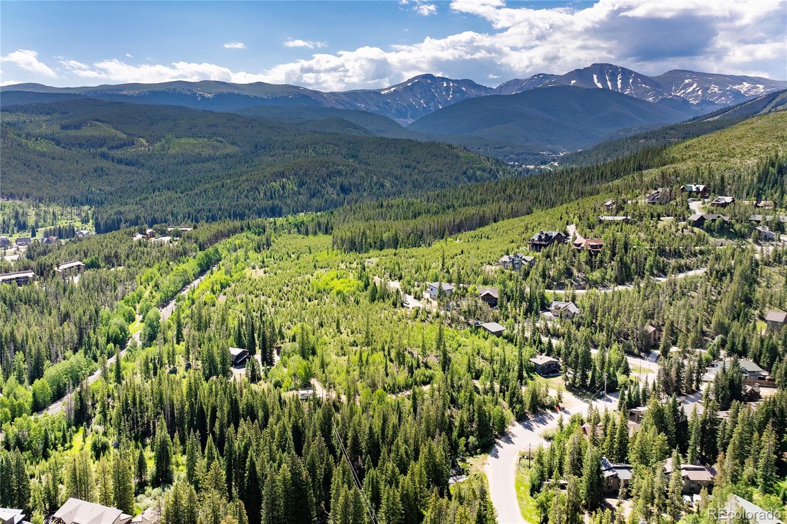 100 Arapahoe Road Winter Park, CO 80482 - Photo 15 of 34 a view of a lush green hillside and an houses