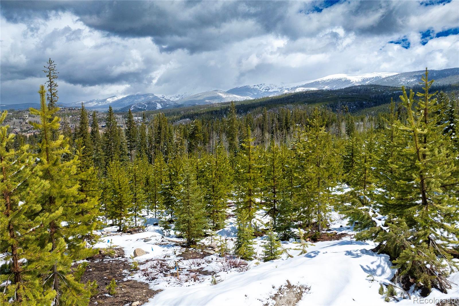 100 Arapahoe Road Winter Park, CO 80482 - Photo 21 of 34 a view of a lake with a building in the background