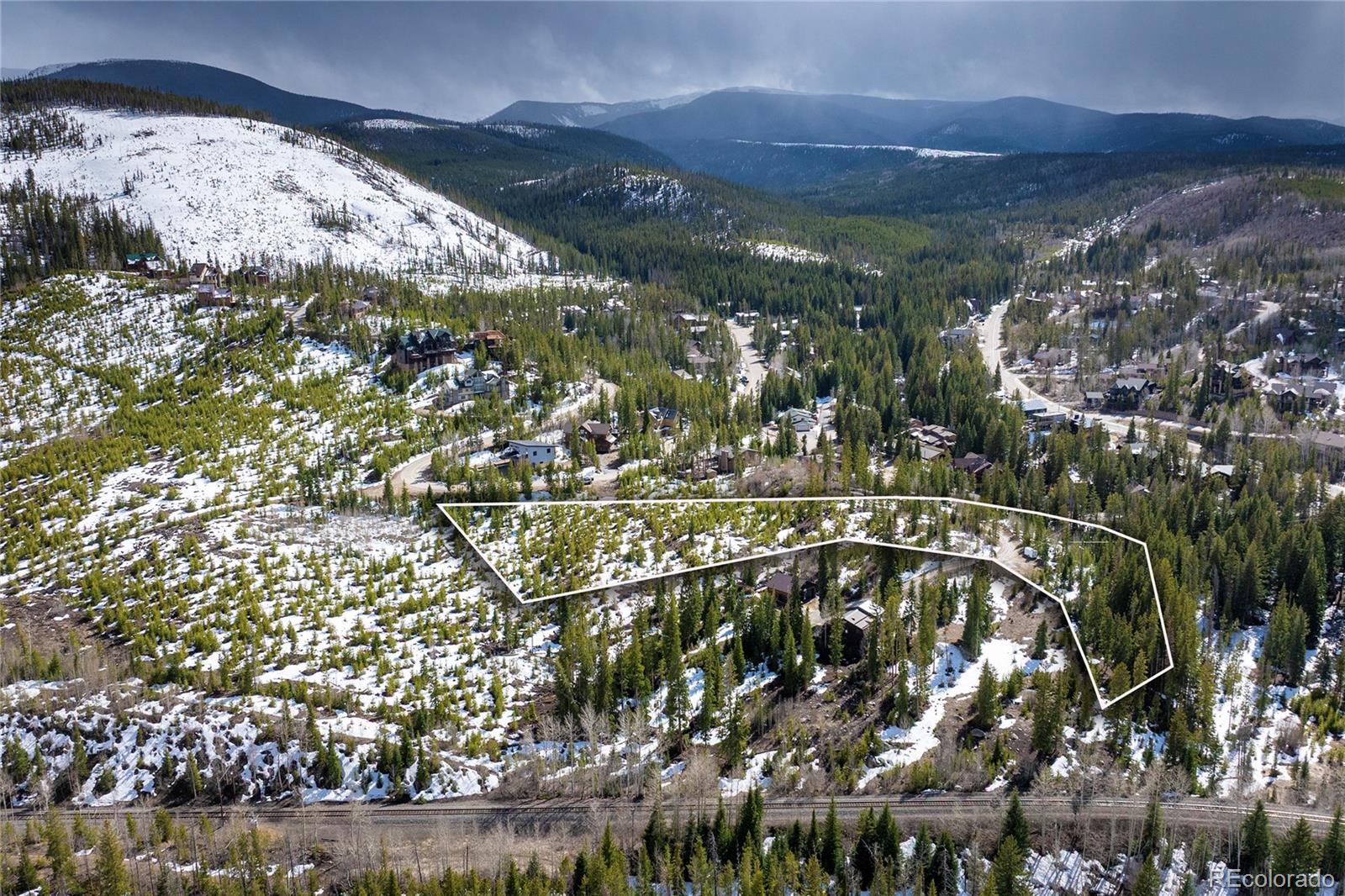 100 Arapahoe Road Winter Park, CO 80482 - Photo 25 of 34 a view of a swimming pool with a yard