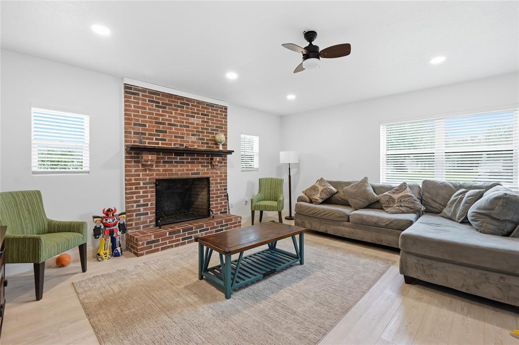 1946 Strathaven Road Winter Park, FL 32792 - Photo 3 of 37 a living room with furniture and a fireplace