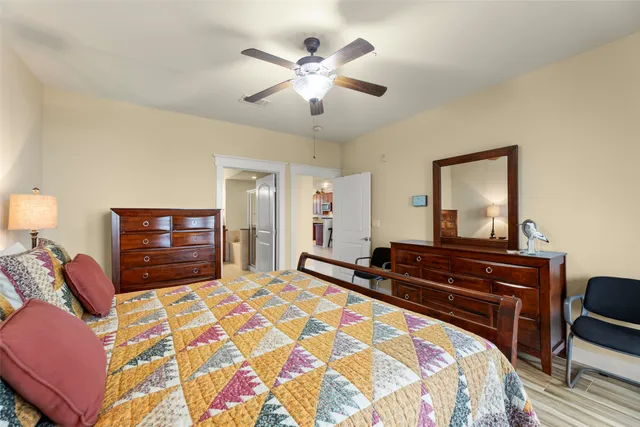 a bathroom with a granite countertop double vanity sink a large mirror a shower and bathtub