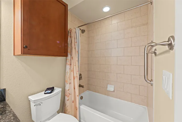 a bathroom with a granite countertop sink a mirror and a vanity