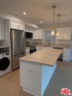 a bathroom with a toilet sink and shower