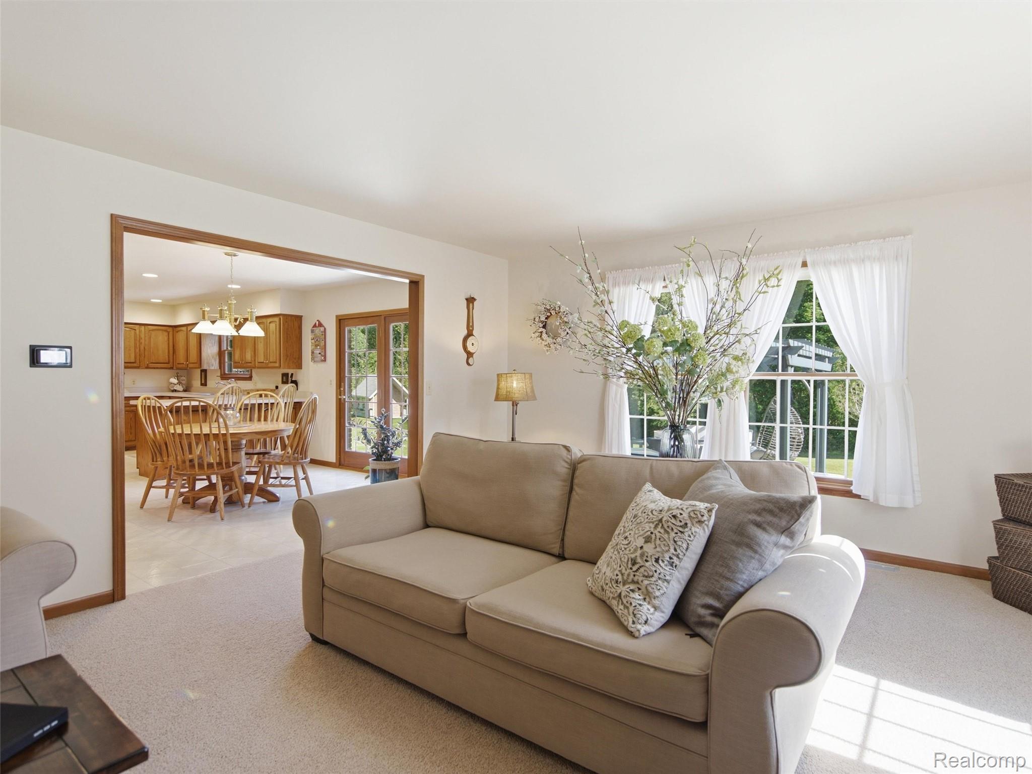 5449 Lum Road Attica, MI 48412 - Photo 31 of 82 Bright living area with plush carpeting and natural light