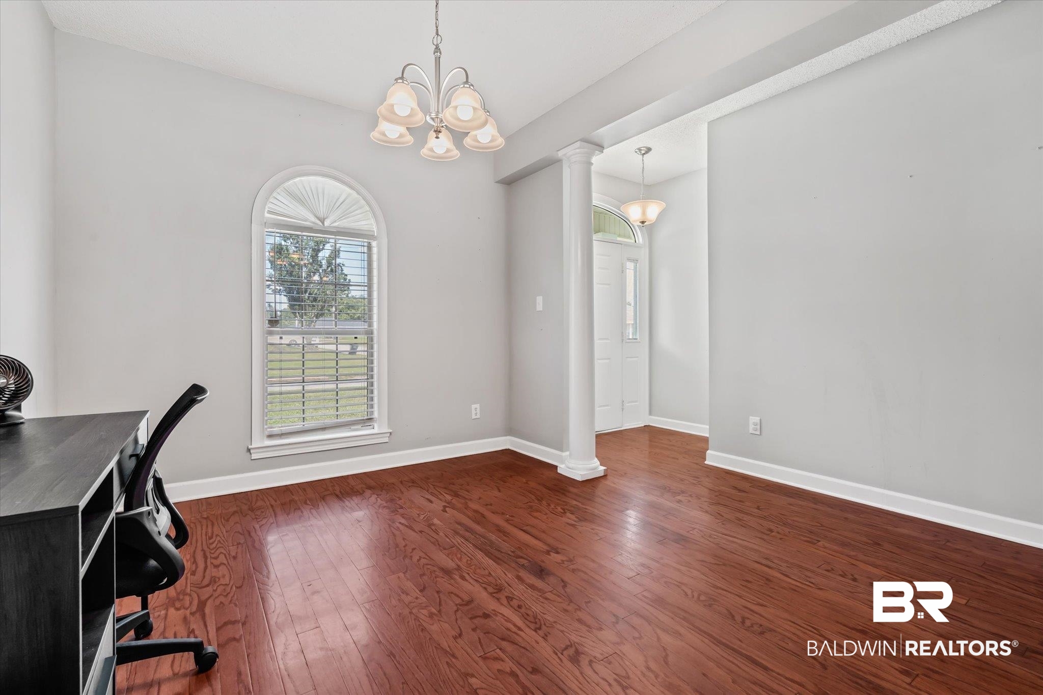 2320 Sequoya Trail Mobile, AL 36695 - Photo 2 of 20 Office area with dark hardwood / wood-style floors, a notable chandelier, and ornate columns