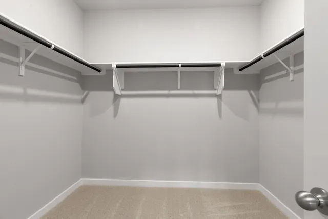 a view of an empty walk in closet